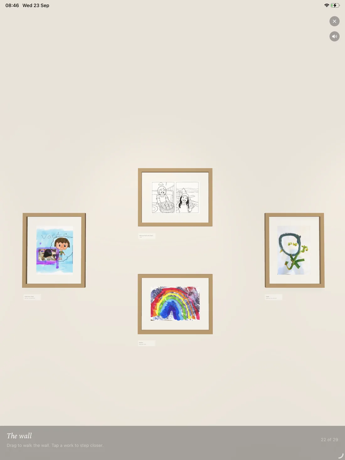 Atelier on iPad: the children's wall, with a rainbow and three other drawings framed on a pale wall.